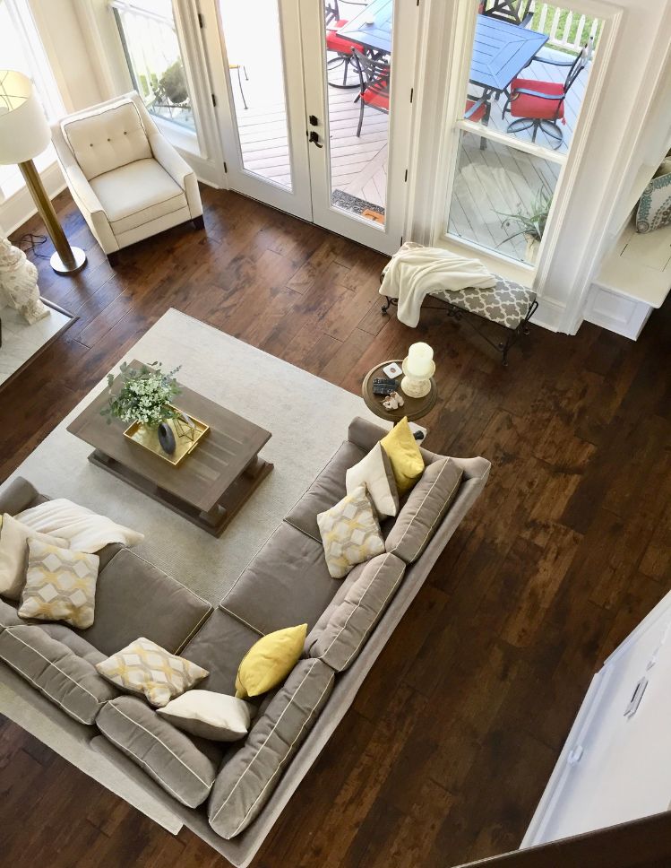 grey area rug in a Marrero, LA living room with wood floors