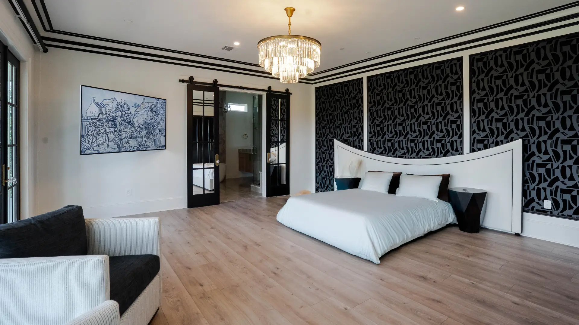 light wood flooring in bedroom with black and white accents