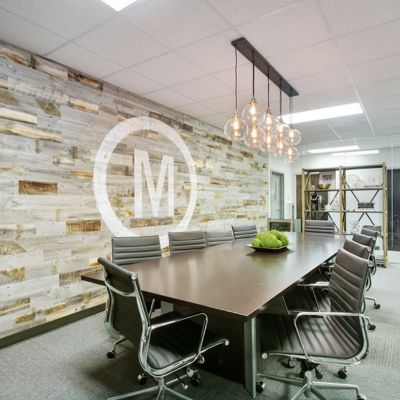 commercial carpet and tile accent wall in large conference room