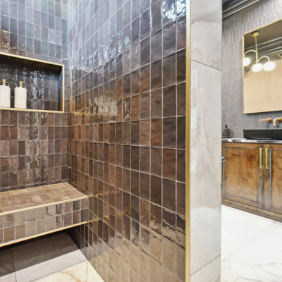 Glass mosaic backsplash tile in a Jefferson Parish bathroom remodel