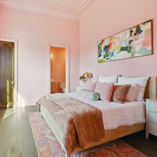 pink area rugs in a pink bedroom